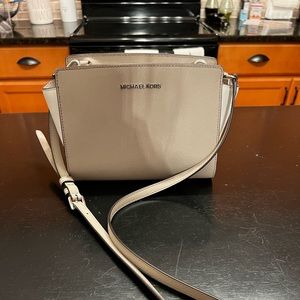 Gray and white Michael Kors crossbody